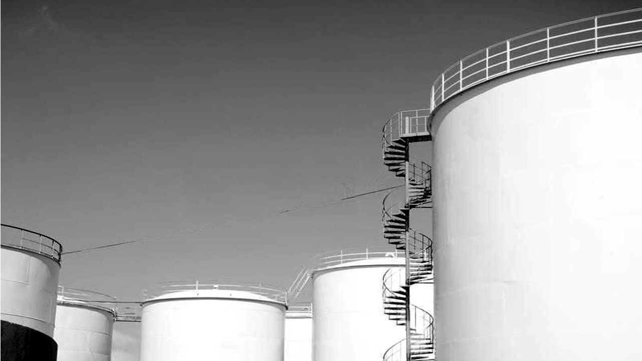 Bulk fuel storage tanks against open sky
